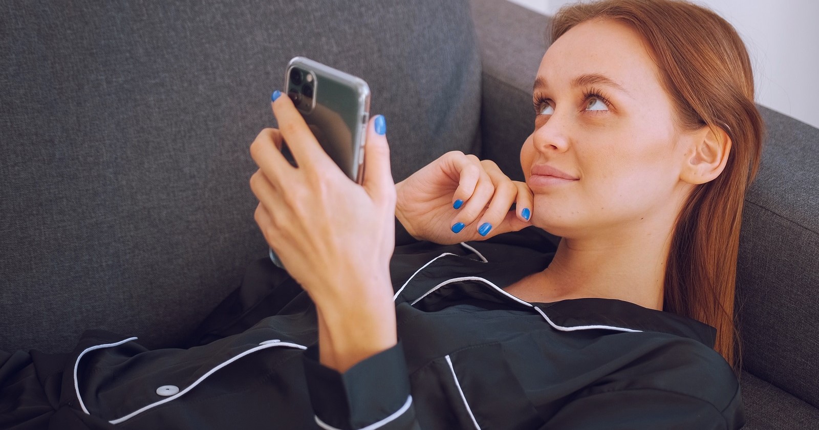 using mobile on the sofa