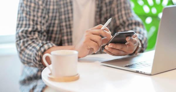 working with mobile and laptop